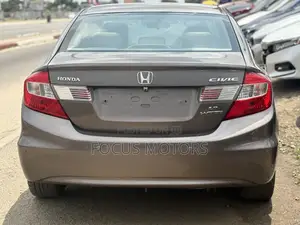 Honda Civic EX-L 2dr Coupe (1.8L 4cyl CVT) 2014 Gold