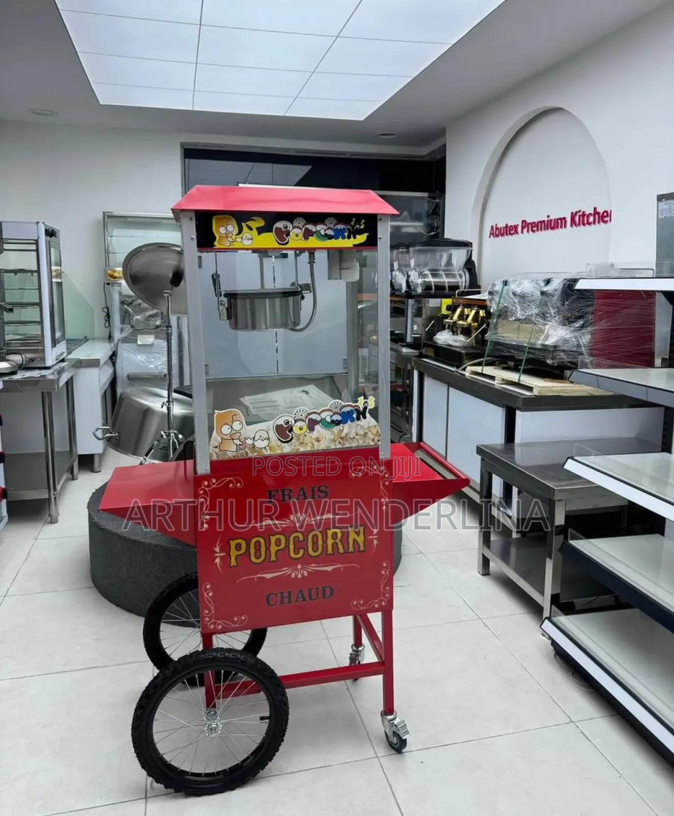 Electric Porpcorn Machine With a Wheel Stand.