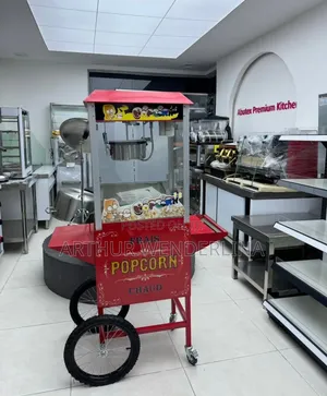 Electric Porpcorn Machine With a Wheel Stand.