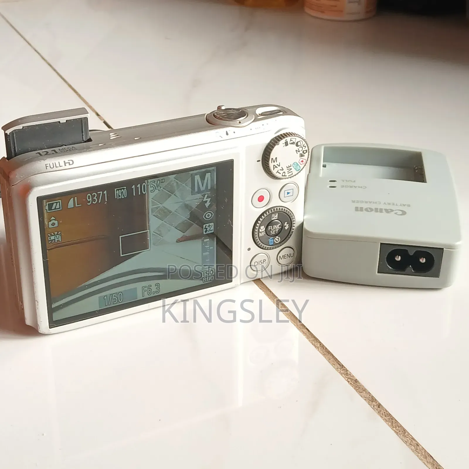 Digital Camera(Canon) Plus Free Charger and Memory Card.