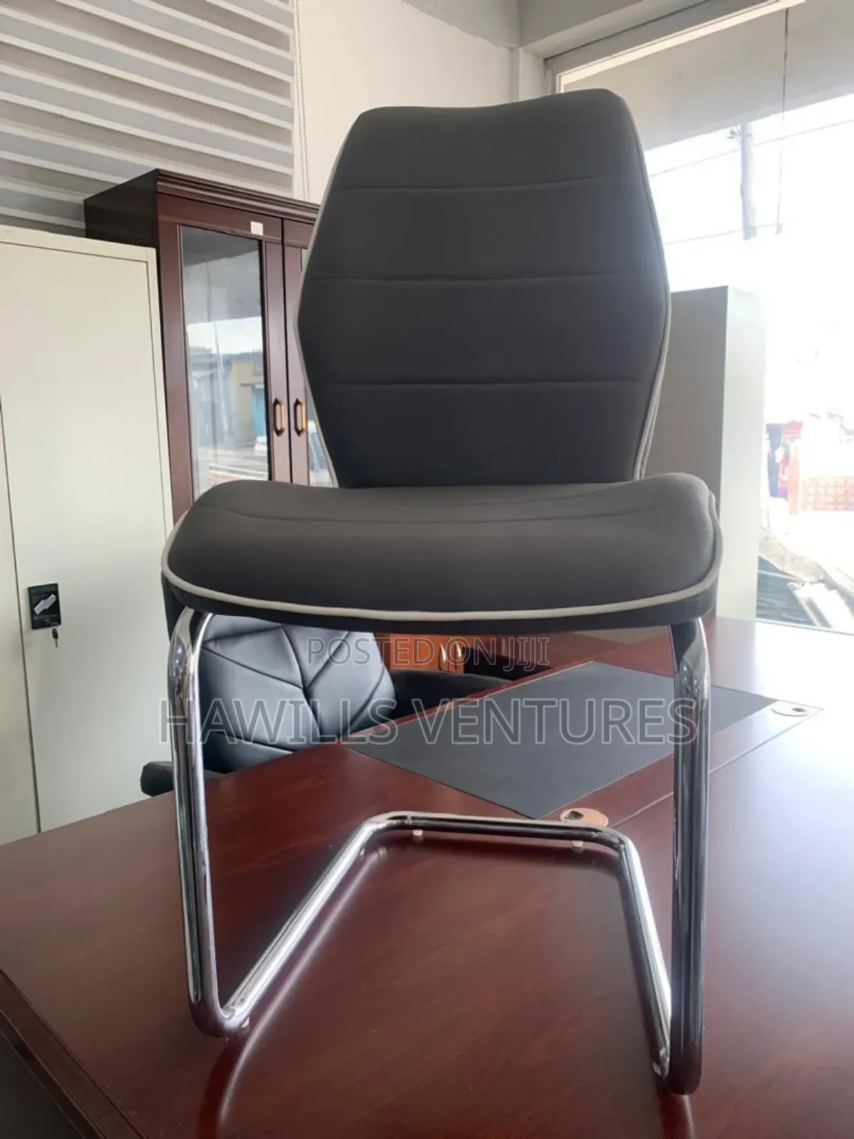 Gray Leather Dining Chair Featuring a C-Shape Chrome Metal.
