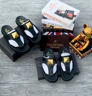 Valentino Garavani Roman Stud Leather Sandals.