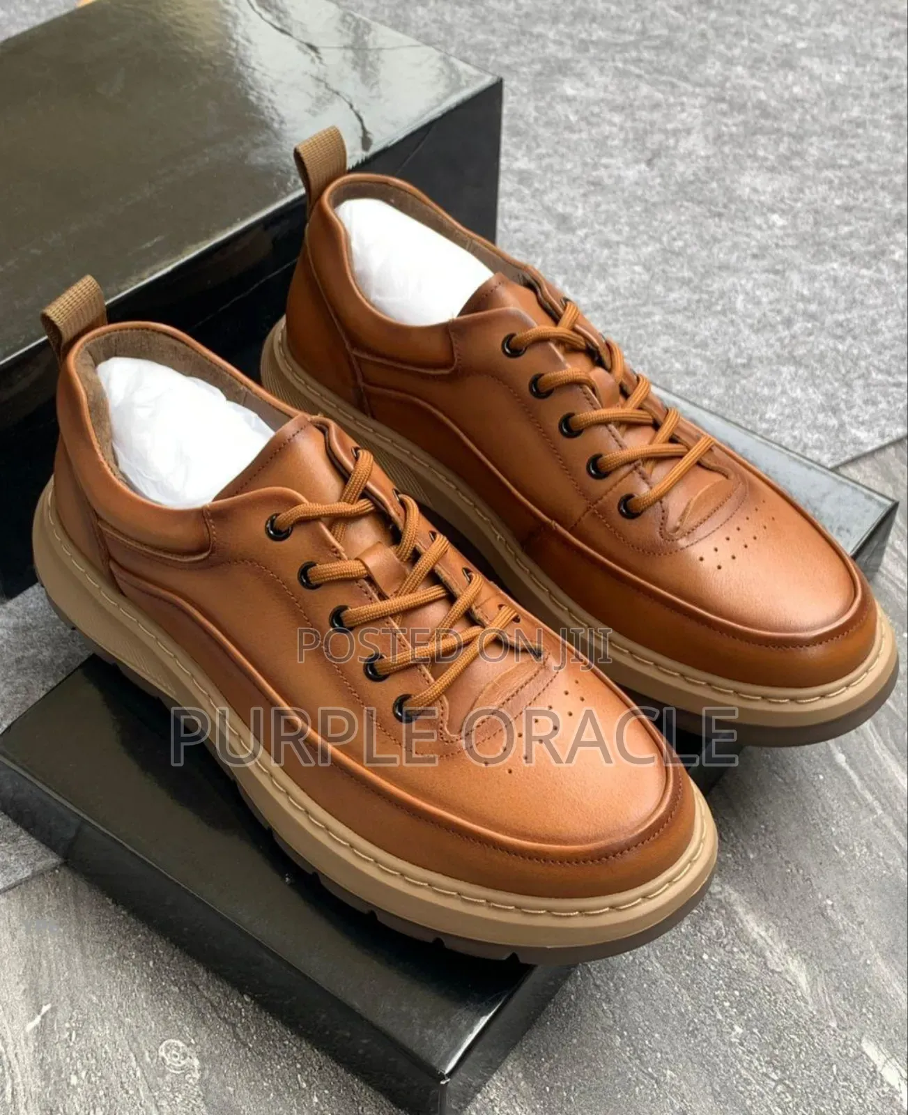 Brown Leather Casual Sneakers With a Lace-Up Design.