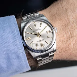 Rolex Oyster Perpetual Men's Steel Dome Bezel Watch 134300.