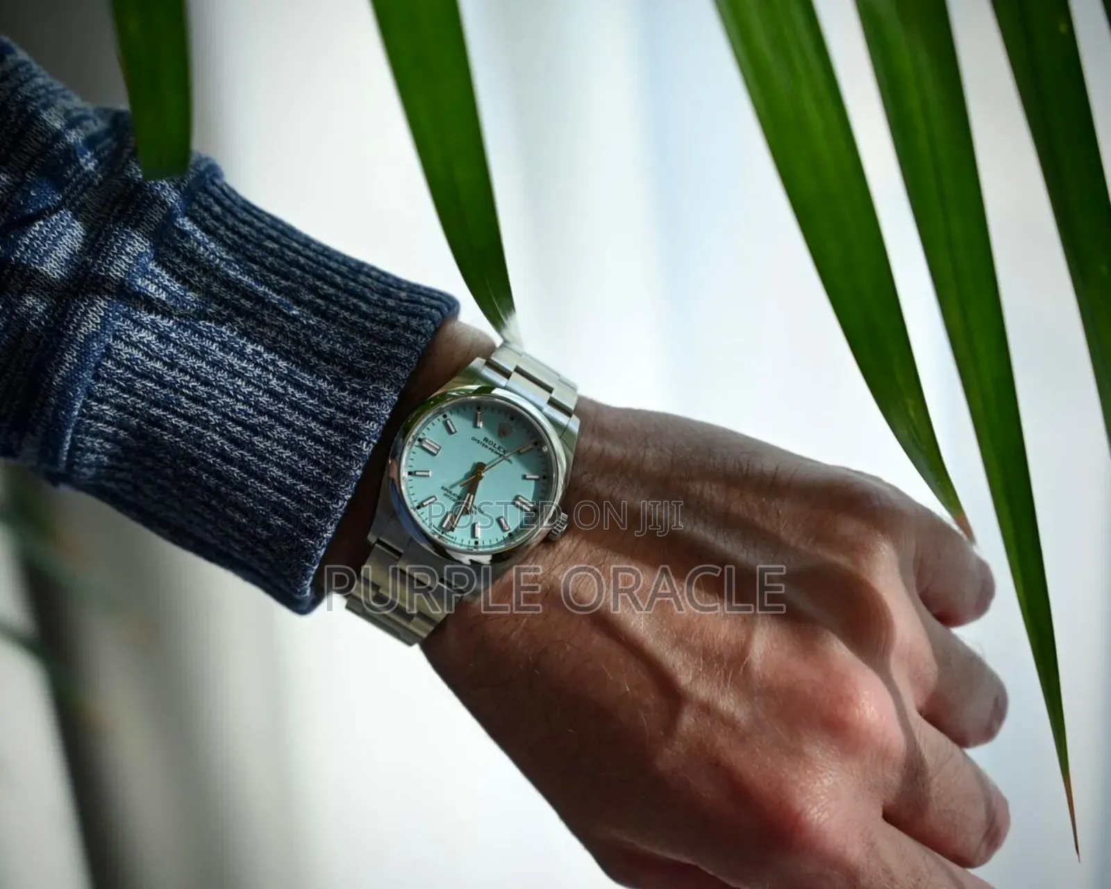 Rolex Oyster Perpetual Men's Steel Dome Bezel Blue Dial Watch.
