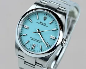 Rolex Oyster Perpetual Men's Steel Dome Bezel Blue Dial Watch.