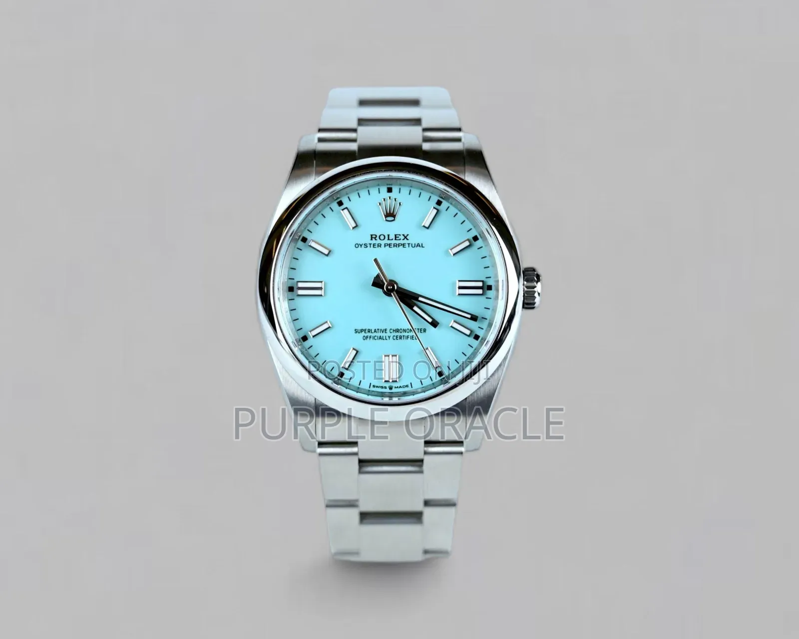 Rolex Oyster Perpetual Men's Steel Dome Bezel Blue Dial Watch.