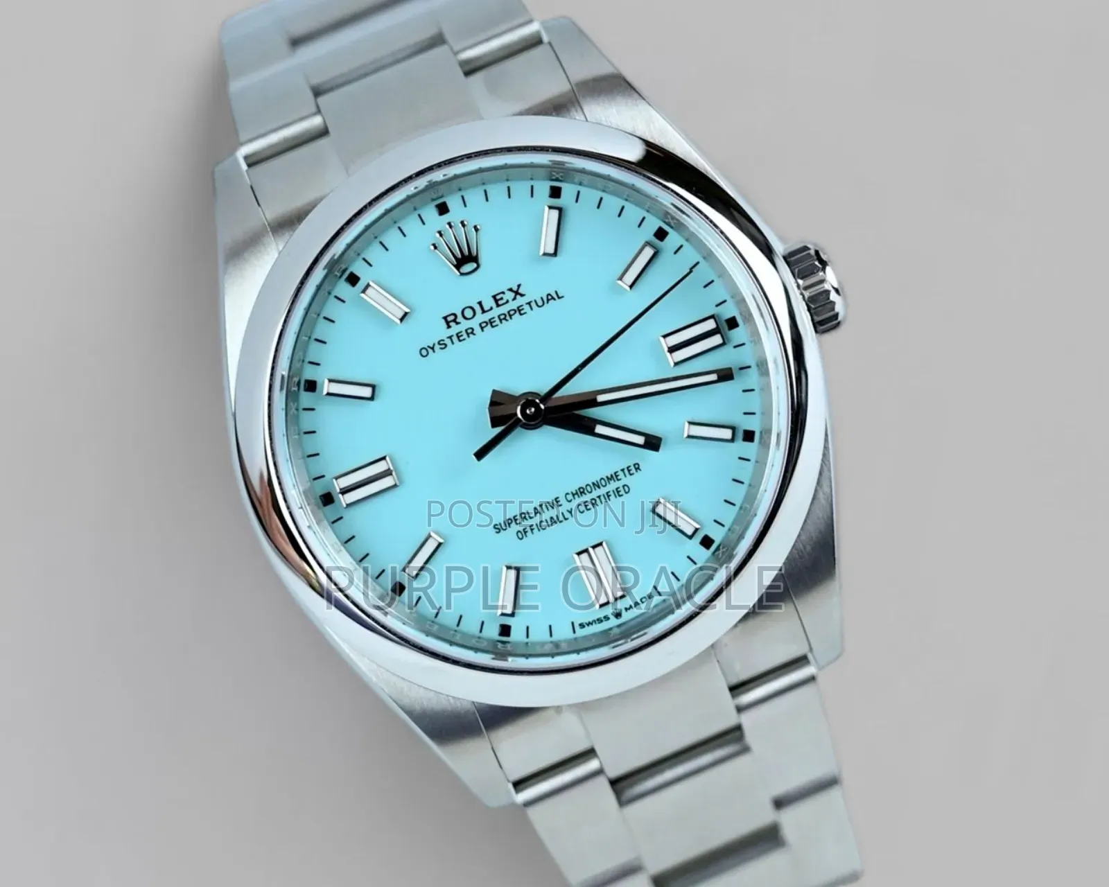 Rolex Oyster Perpetual Men's Steel Dome Bezel Blue Dial Watch.