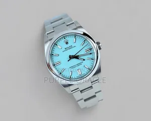 Rolex Oyster Perpetual Men's Steel Dome Bezel Blue Dial Watch.
