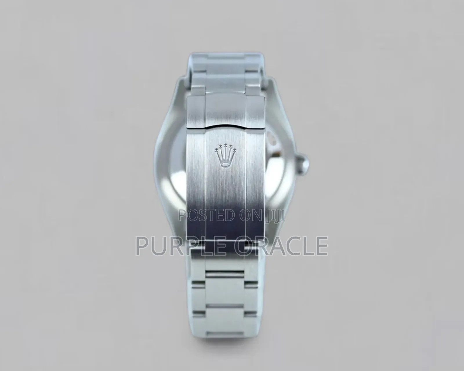 Rolex Oyster Perpetual Men's Steel Dome Bezel Blue Dial Watch.