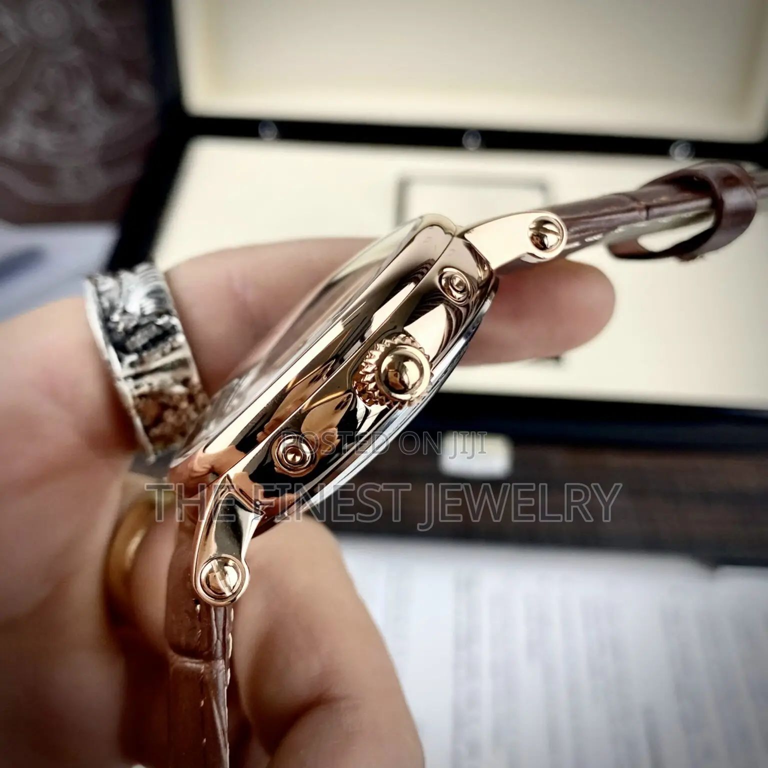 Patek Philippe Watch With a Brown Leather Strap and Rose Gold Case
