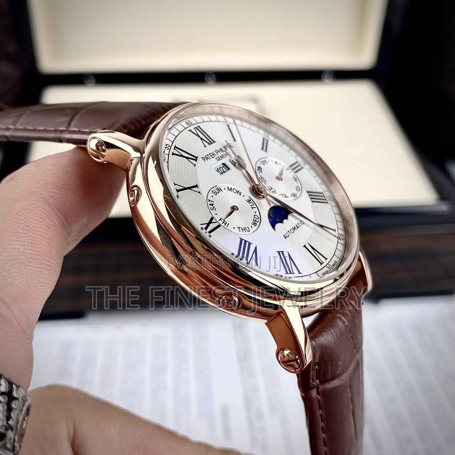 Patek Philippe Watch With a Brown Leather Strap and Rose Gold Case