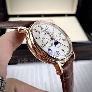 Patek Philippe Watch With a Brown Leather Strap and Rose Gold Case