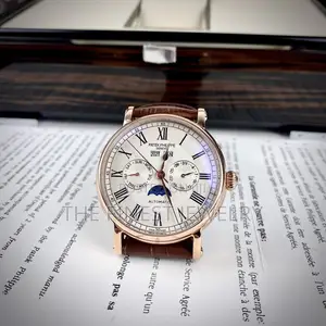 Patek Philippe Watch With a Brown Leather Strap and Rose Gold Case