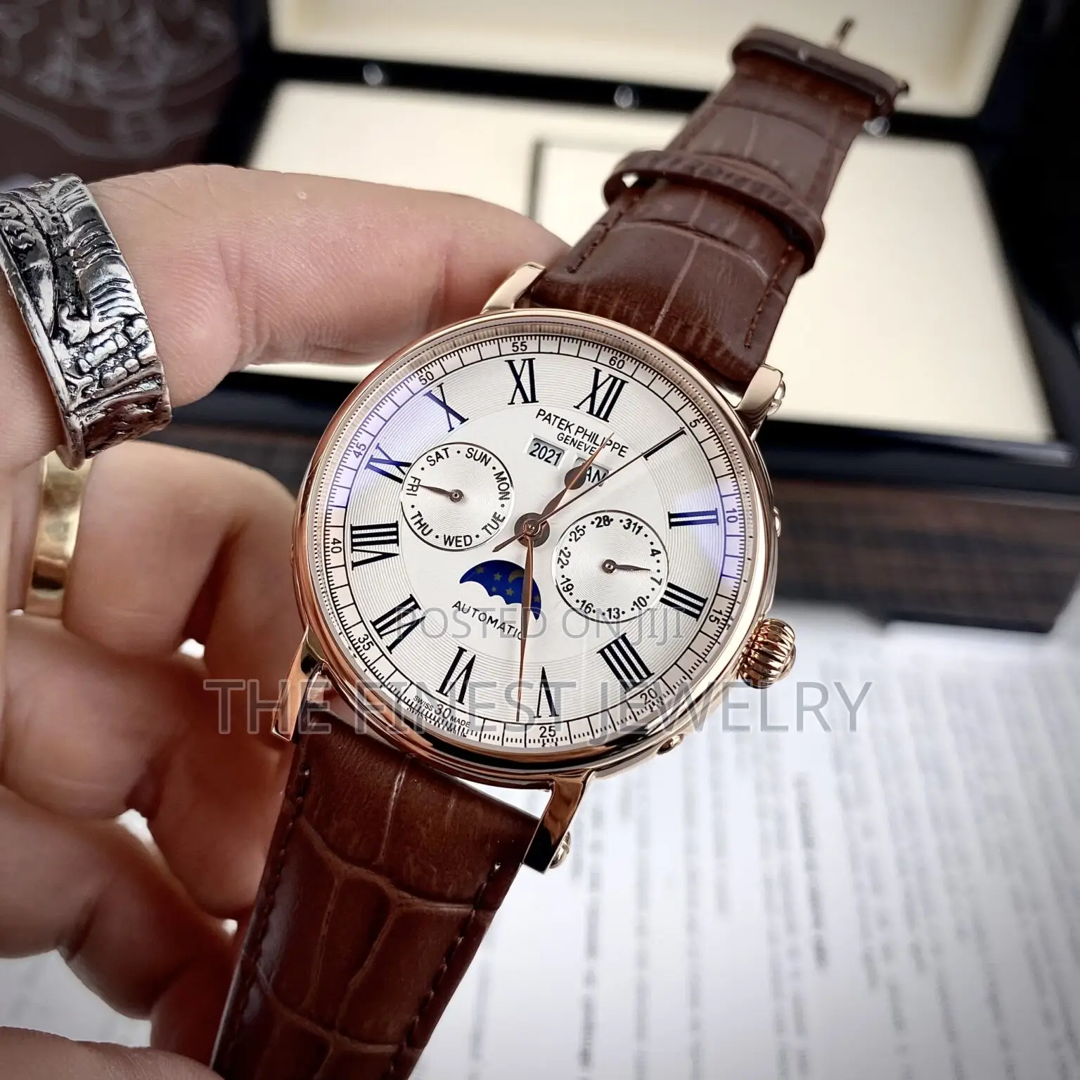 Patek Philippe Watch With a Brown Leather Strap and Rose Gold Case