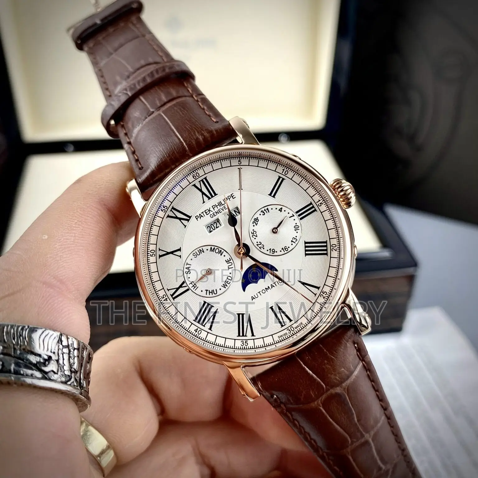 Patek Philippe Watch With a Brown Leather Strap and Rose Gold Case