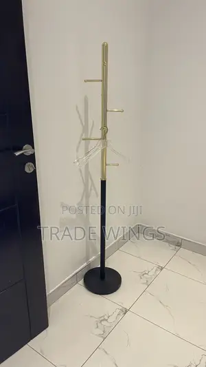 Black And Gold Pole For Hanging Dresses