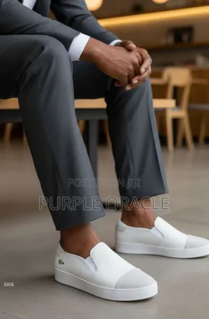Lacoste Men's White Slip-on Sneakers.