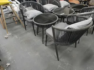 Rope-Woven Armchairs and a Round Bistro Table With Tempered Glass Top.