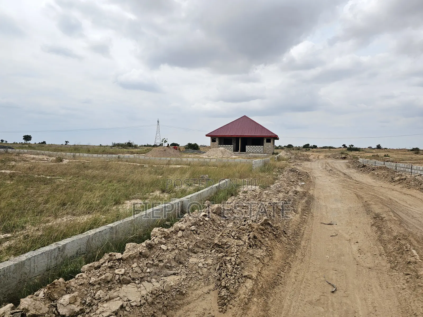 Own a Genuine Half Plot Near Tsopoli Police Barrier at Skyport City