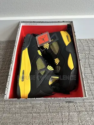 Air Jordan 4 Retro Thunder Sneakers in Yellow and Black Colorway