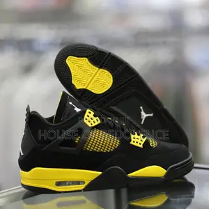 Air Jordan 4 Retro Thunder Sneakers in Yellow and Black Colorway