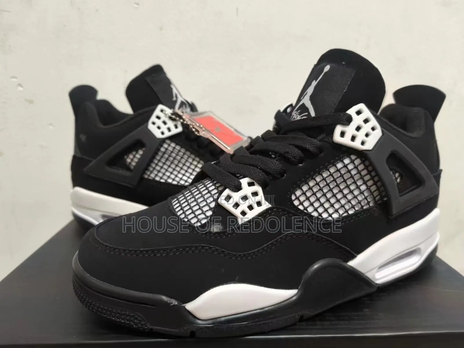 Air Jordan 4 Retro White Thunder Sneakers