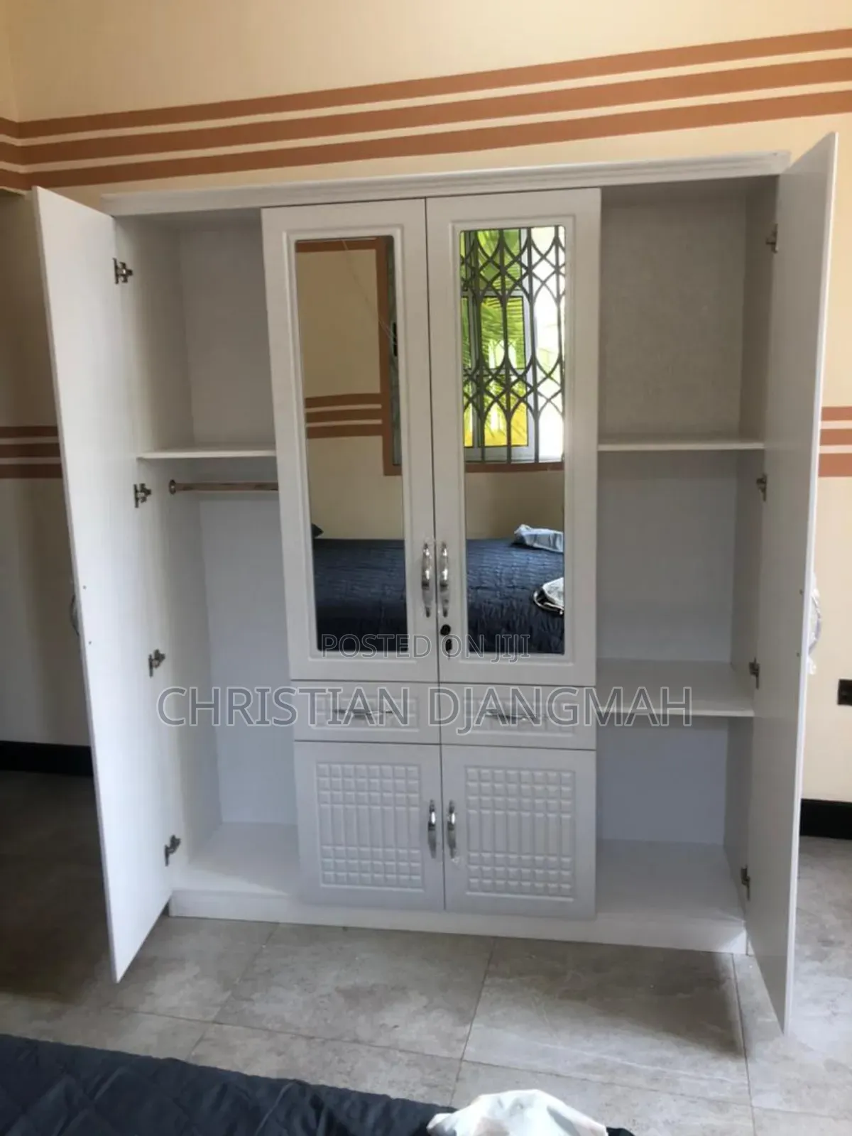 Ultra Modern Four Door Foreign Wardrobe.