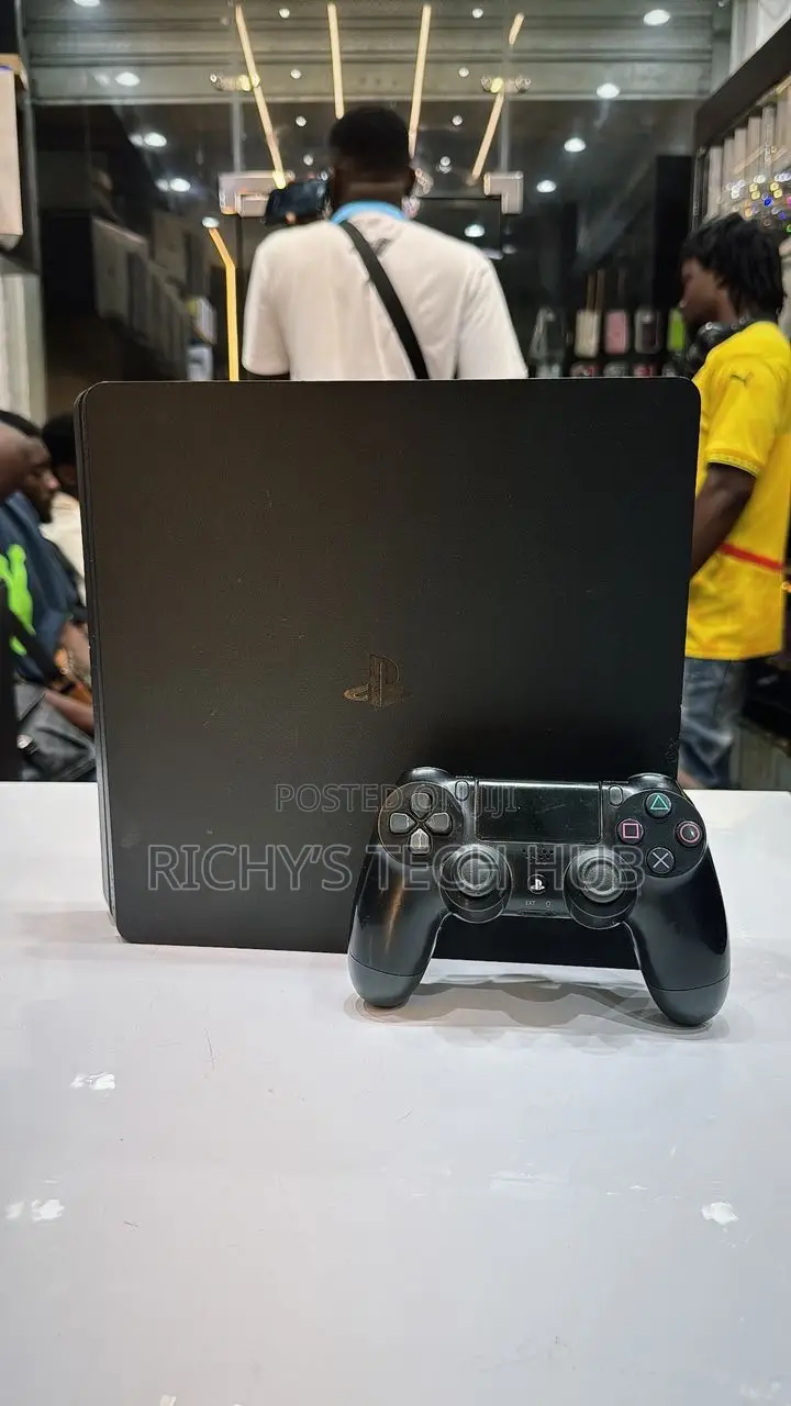 Neat Playstation 4 Slim With 11 Games and 2 Original Gamepads