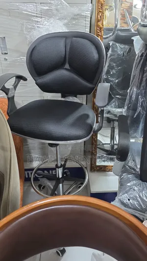 Counter Chair Features a Swivel Base.