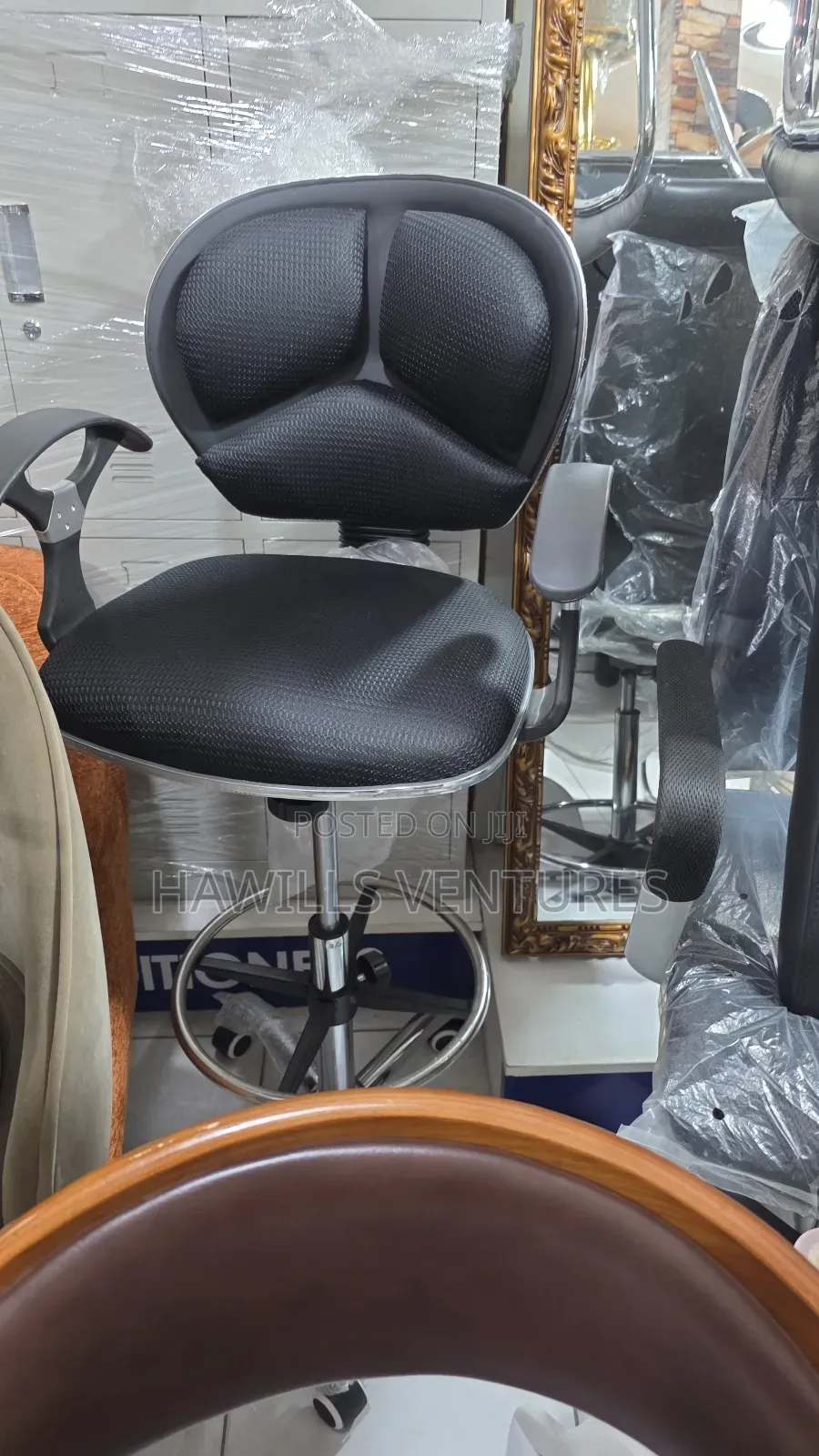 Counter Chair Features a Swivel Base.