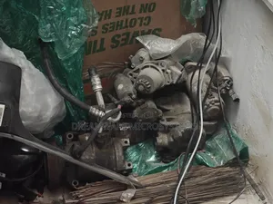Assorted Auto Parts Nissan and Chrysler Starter, Ac Compressor Etc