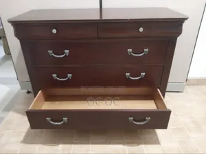 Dark Wood Dresser Features Decorative Silver Handles