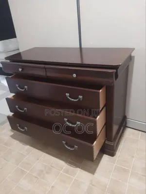 Dark Wood Dresser Features Decorative Silver Handles