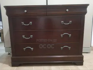 Dark Wood Dresser Features Decorative Silver Handles