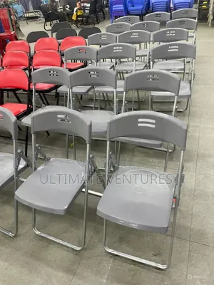 Gray Plastic Folding Chair With Chrome Frame