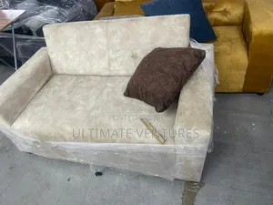 Cream Suede 2-Seater Loveseat.