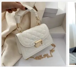 Elegant White Quilted Leather Bag With Gold Accents