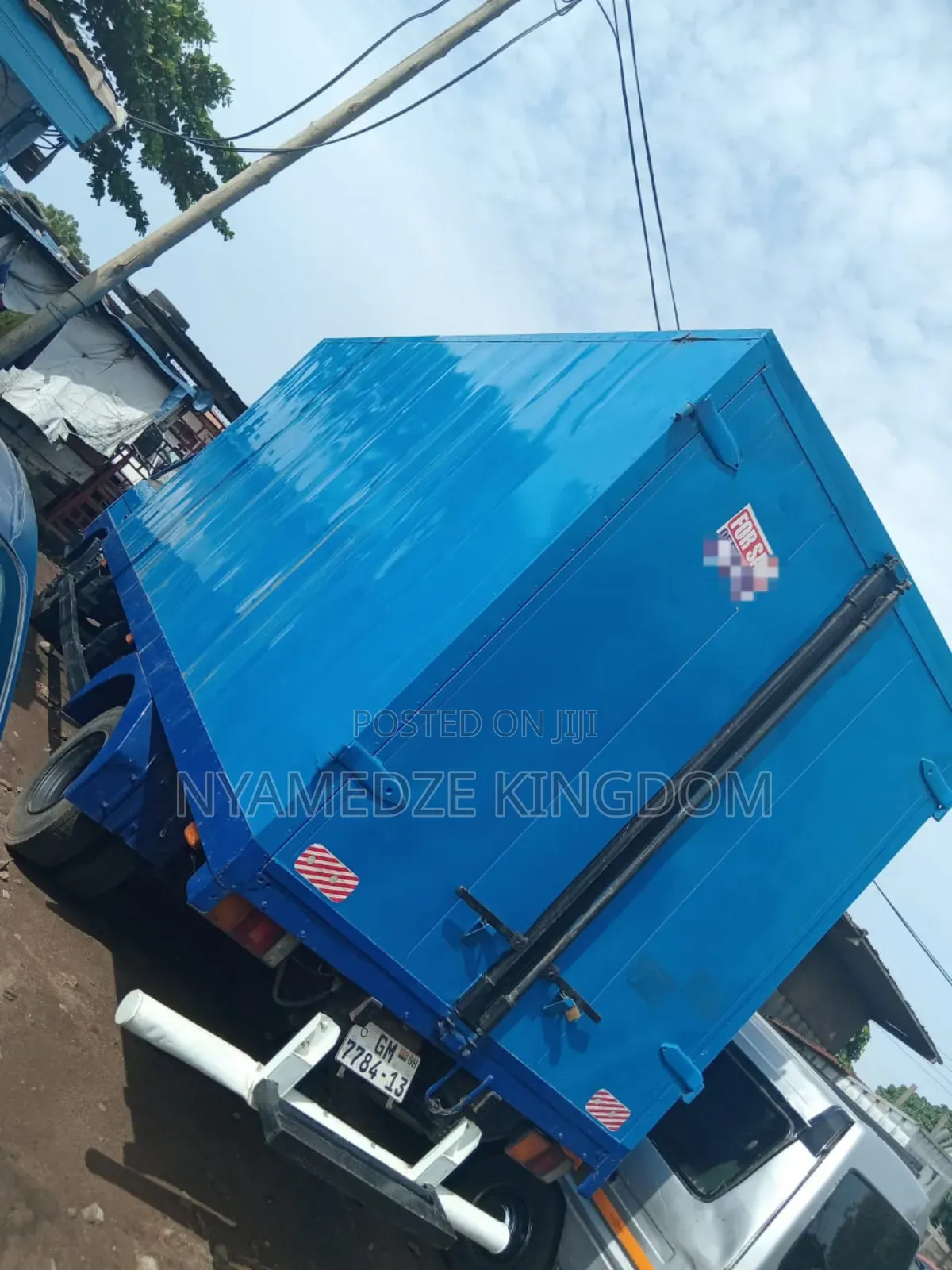 Blue Isuzu Container Truck