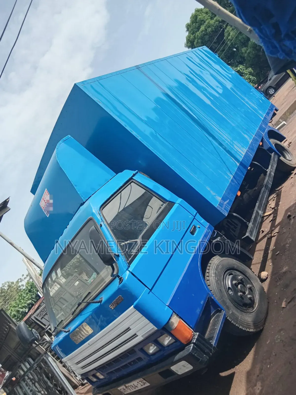 Blue Isuzu Container Truck