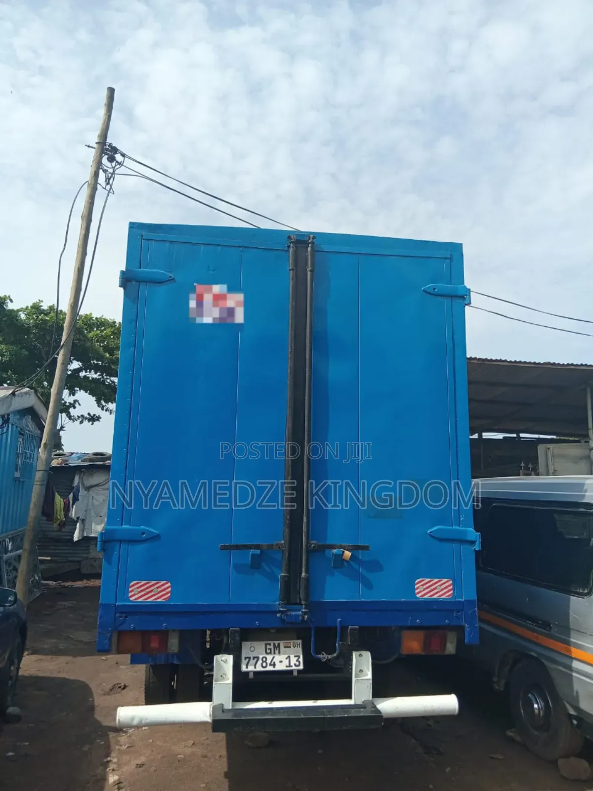 Blue Isuzu Container Truck