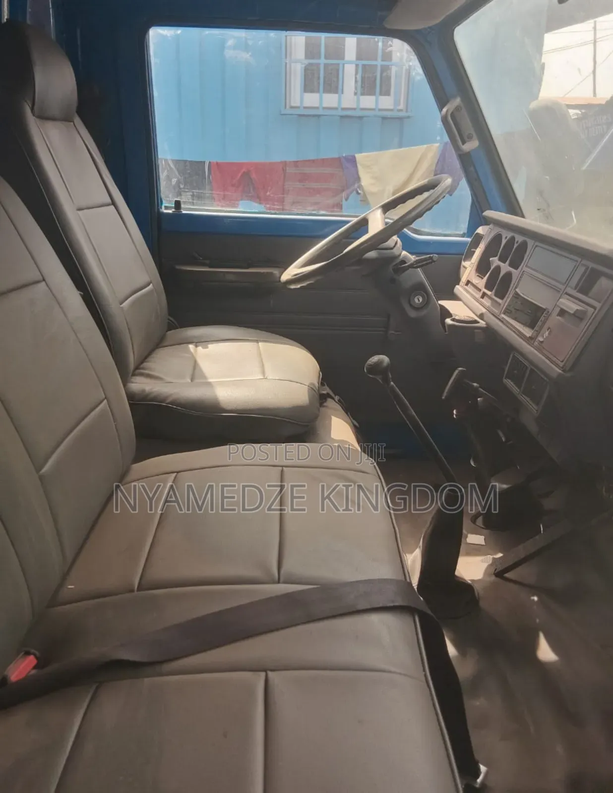 Blue Isuzu Container Truck