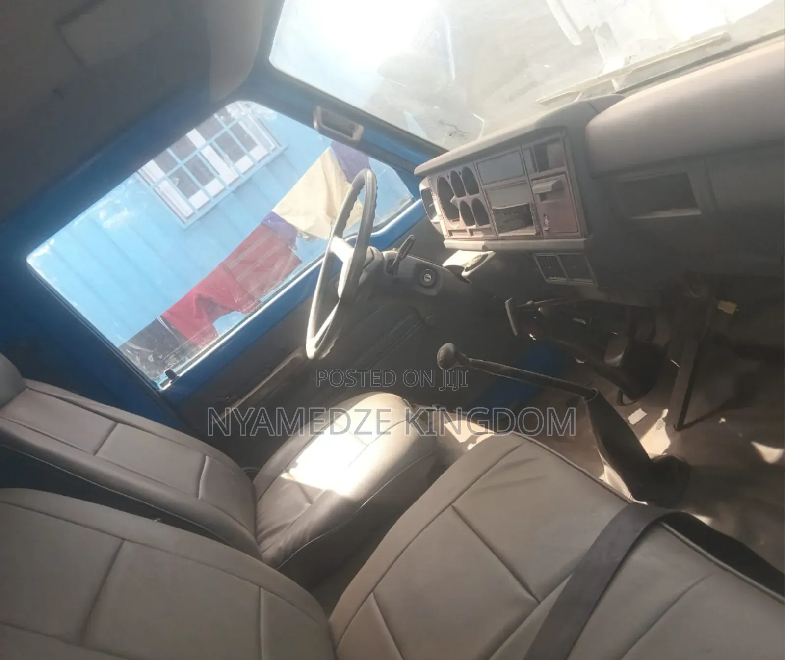 Blue Isuzu Container Truck