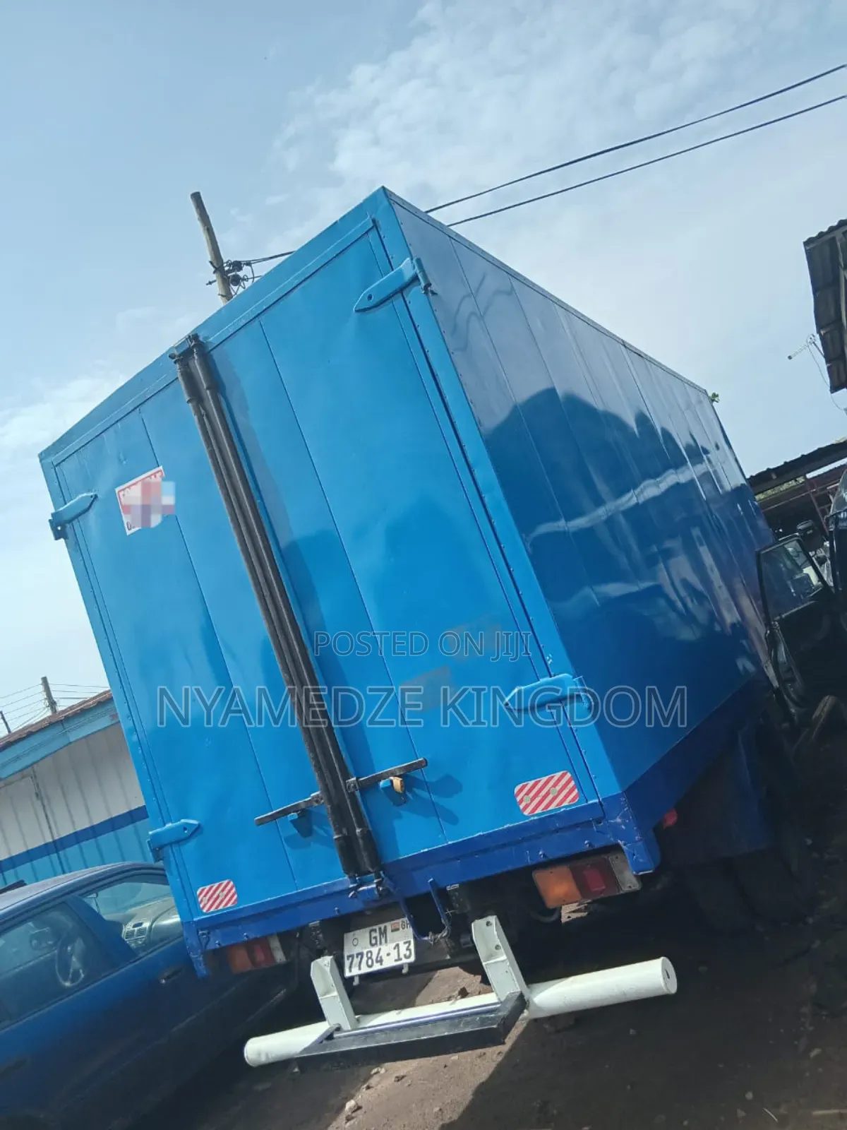 Blue Isuzu Container Truck