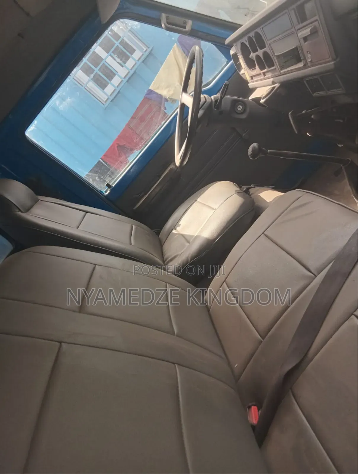 Blue Isuzu Container Truck