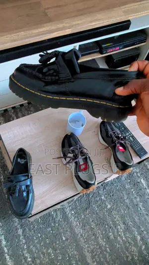 Dr. Martens Shoe and New Balance Sneakers