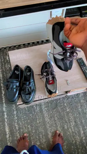 Dr. Martens Shoe and New Balance Sneakers