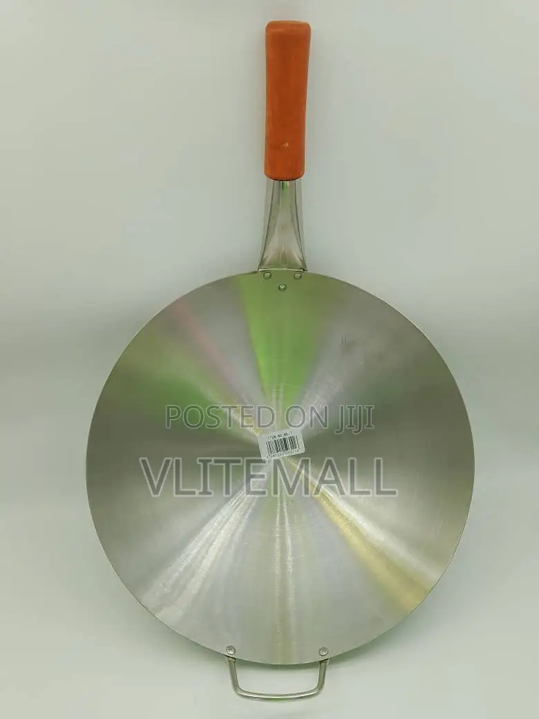 An Aluminum Tawa (Flat Frying Pan) Long Wooden Handle a Small Loop.