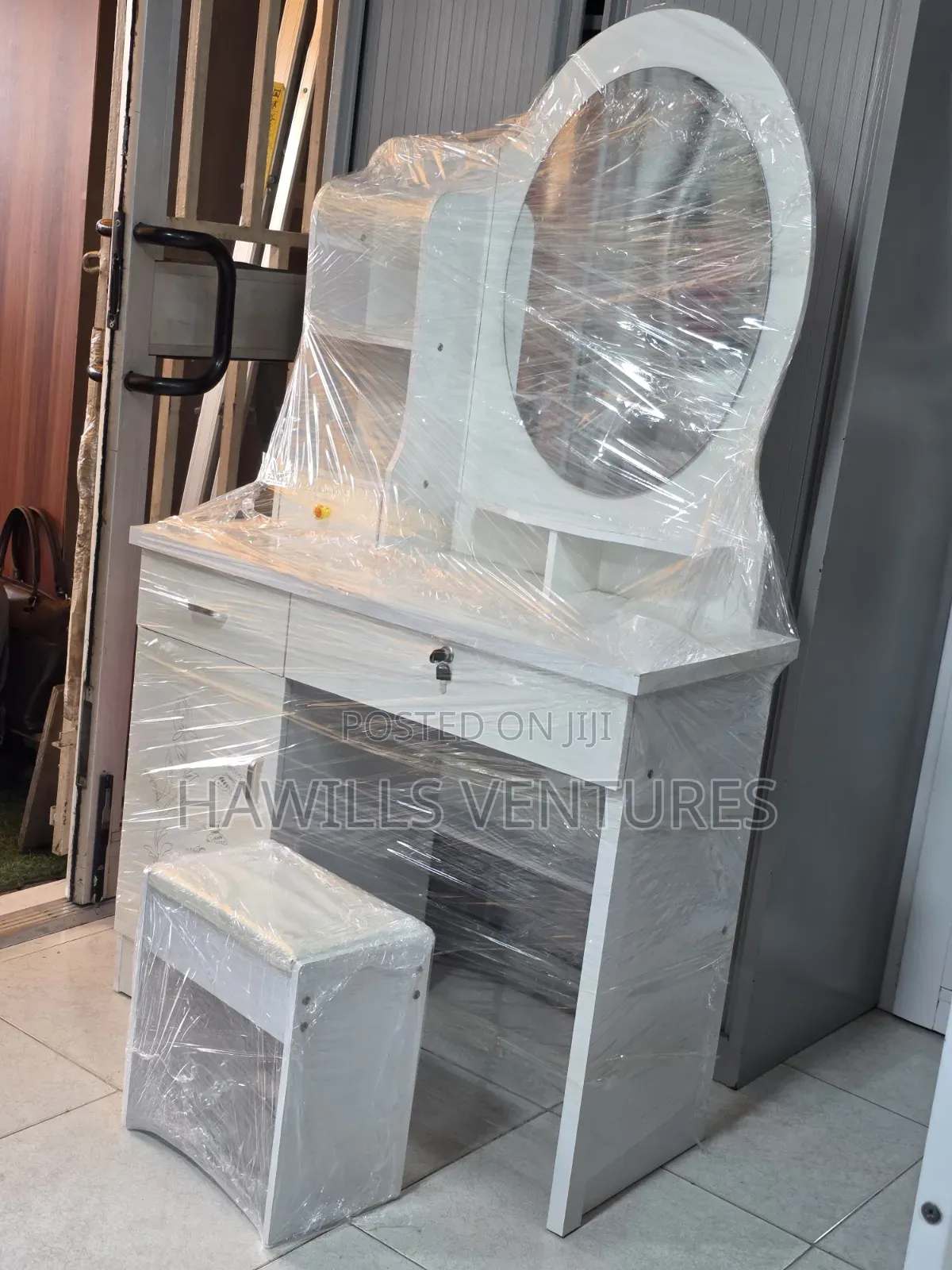 White Vanity Dressing Table Set Featuring an Oval Mirror.