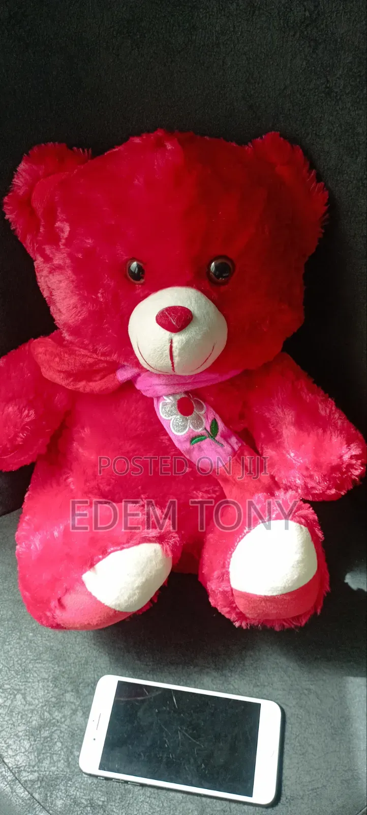 A Red Fluffy Teddy Bear With Dimensions 43×31cm